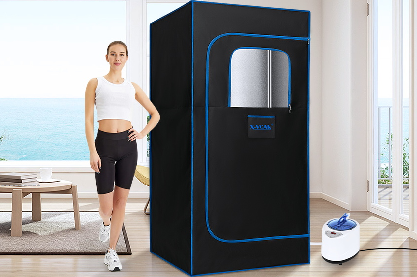 Girl in workout clothes standing next to portable sauna