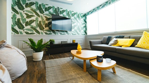 A living room with a couch and a television