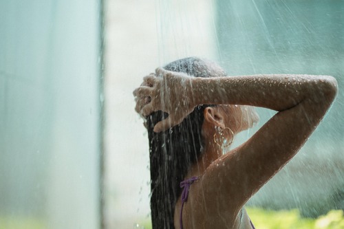 woman washing hair after swimming