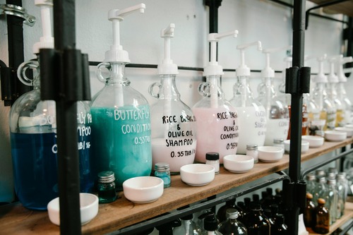 Bottles of hair conditioner on shelf