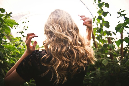 close-up of blonde haired woman in the outdoors