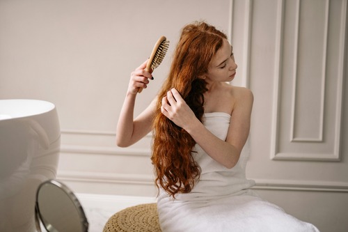 Woman brushing long hair